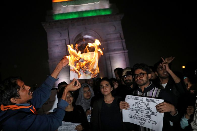 Demonstrators burn a copy of India's Citizenship Amendment Bill during a protest in New Delhi REUTERS