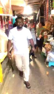 A Ghanaian Trader brandishing a machete during the incident